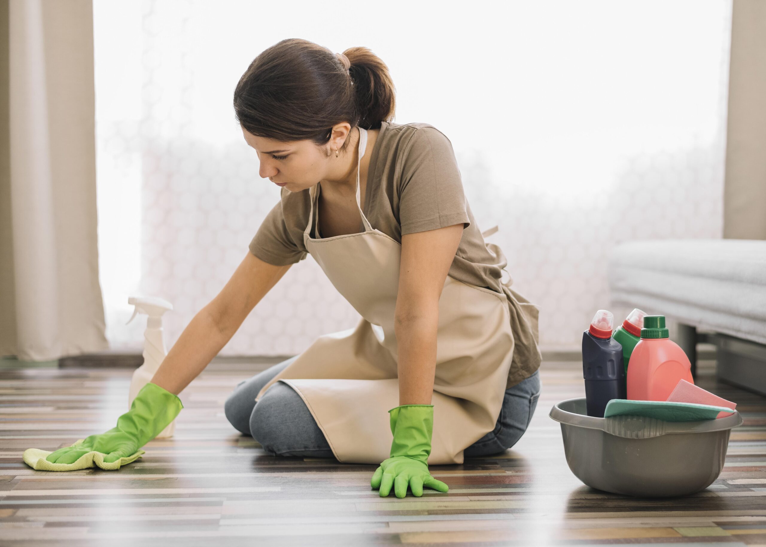 woman-with-gloves-cleaning-floor